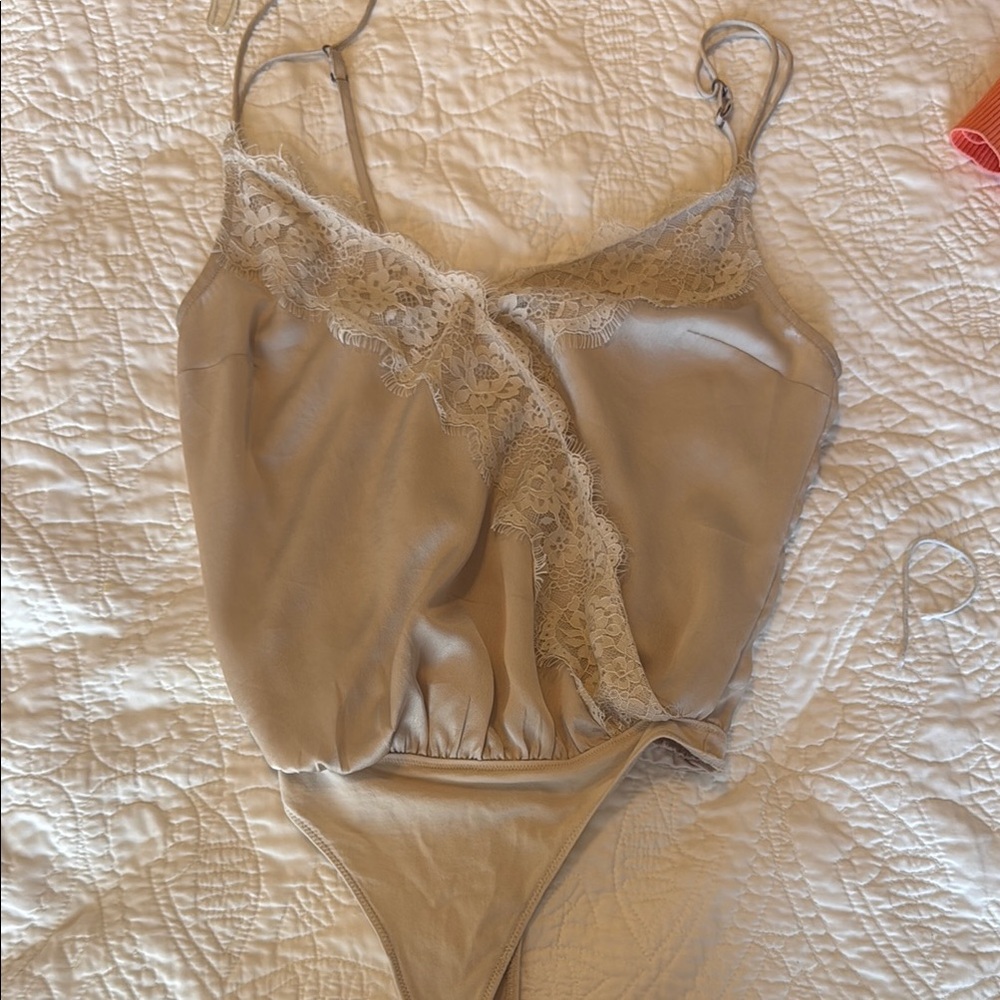 Elegant Lace Trimmed Bodysuit in Beige